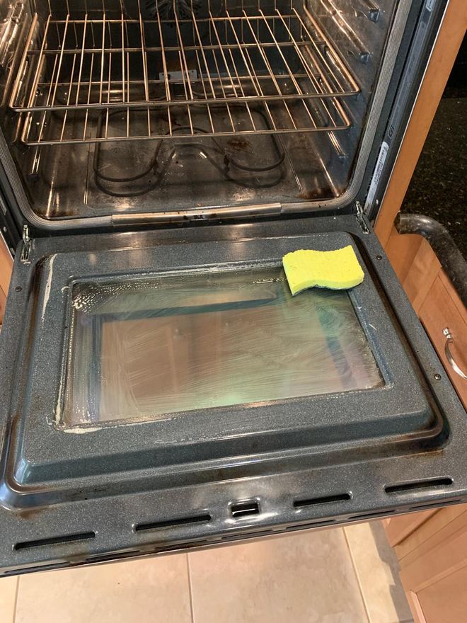 Oven door before cleaning